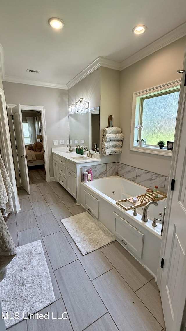 580 Hickory Pl, Brandon, MS 39047 - ensuite bathroom with a jetted tub, vanity, healthy amount of natural light, crown molding, and recessed lighting
