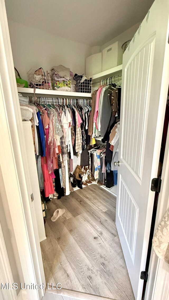 580 Hickory Pl, Brandon, MS 39047 - walk in closet with wood finished floors