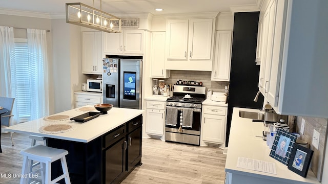 580 Hickory Pl, Brandon, MS 39047 - kitchen featuring appliances with stainless steel finishes, ornamental molding, light countertops, decorative backsplash, and recessed lighting