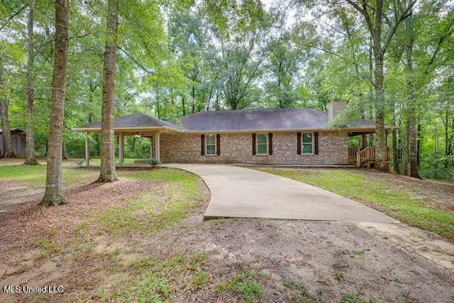 1160 Lucas Rd, Lucedale, MS 39452 - ranch-style home featuring driveway, a chimney, brick siding, and a front yard
