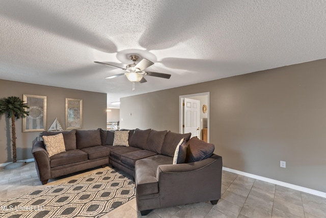 1160 Lucas Rd, Lucedale, MS 39452 - living area with ceiling fan, baseboards, a textured ceiling, and light tile patterned flooring