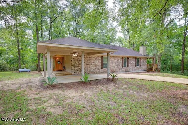 1160 Lucas Rd, Lucedale, MS 39452 - single story home featuring a chimney, covered porch, brick siding, and a ceiling fan