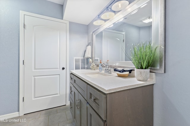 bathroom featuring vanity and tile patterned flooring