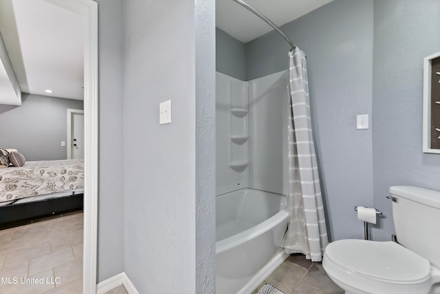 1160 Lucas Rd, Lucedale, MS 39452 - ensuite bathroom with tile patterned floors, toilet, shower / tub combo, and baseboards