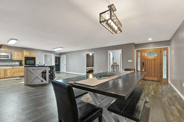 1160 Lucas Rd, Lucedale, MS 39452 - dining space with wood finished floors, baseboards, a textured ceiling, and recessed lighting