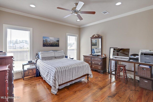 bedroom featuring recessed lighting, wood finished floors, a ceiling fan, visible vents, and crown molding