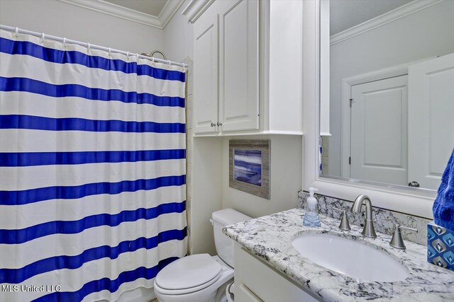 bathroom featuring toilet, a shower with curtain, crown molding, and vanity