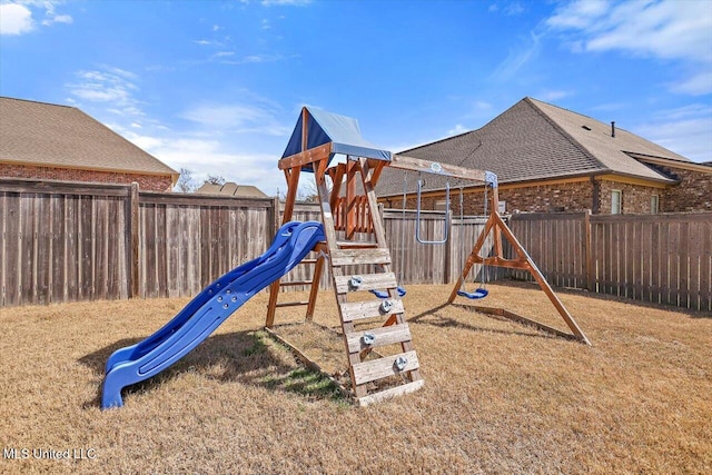 view of jungle gym featuring a fenced backyard and a yard