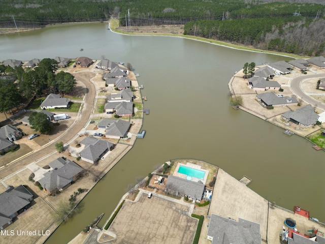 drone / aerial view featuring a water view and a residential view