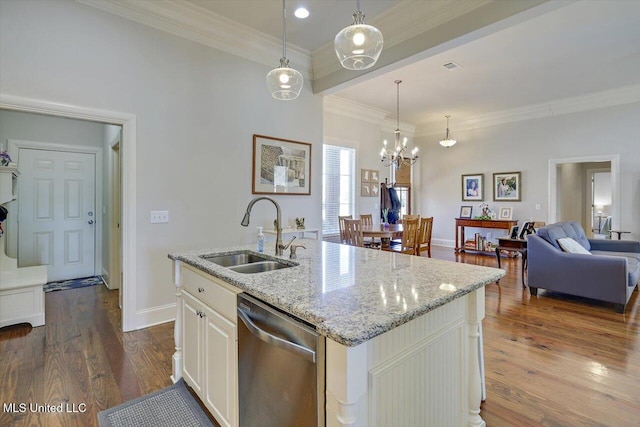 kitchen with dark wood-style floors, stainless steel dishwasher, a sink, and crown molding