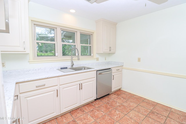 kitchen with stainless steel dishwasher, a sink, white cabinetry, recessed lighting, and light stone countertops