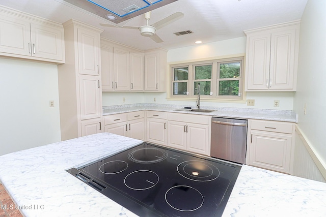 kitchen with stainless steel dishwasher, a sink, a ceiling fan, light stone counters, and white cabinetry
