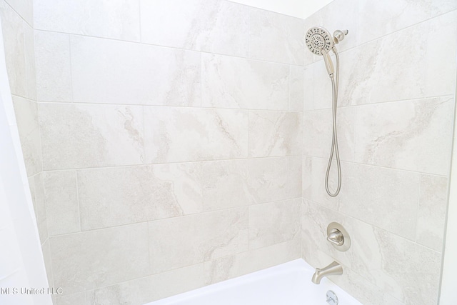 bathroom with shower / bath combination