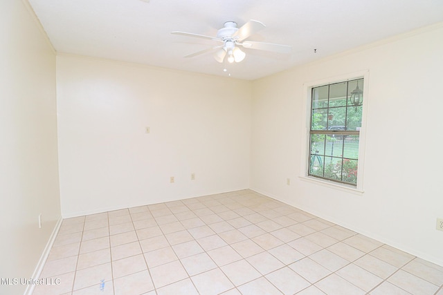 spare room featuring ceiling fan and ornamental molding