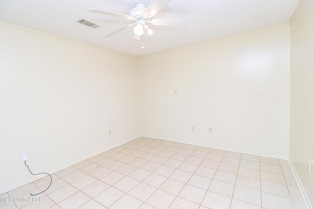 empty room featuring ceiling fan, crown molding, and light tile patterned floors