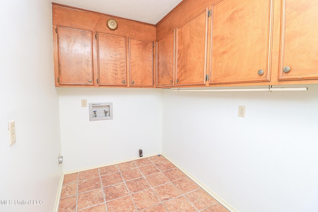 laundry room with cabinet space, washer hookup, and baseboards