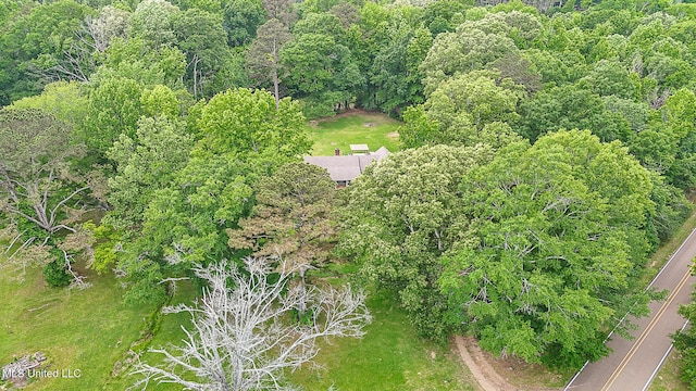 aerial view of property's location with a forest