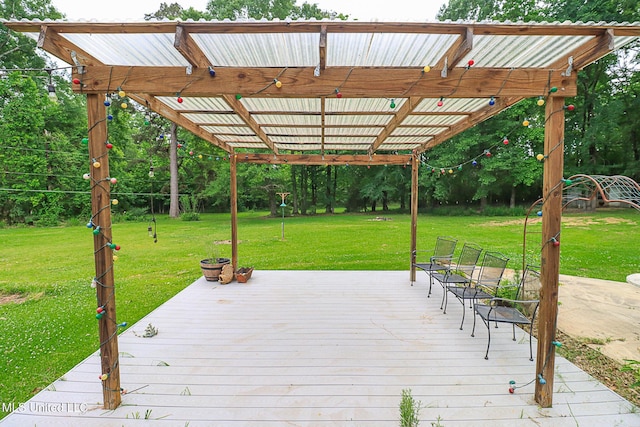 wooden terrace with a lawn