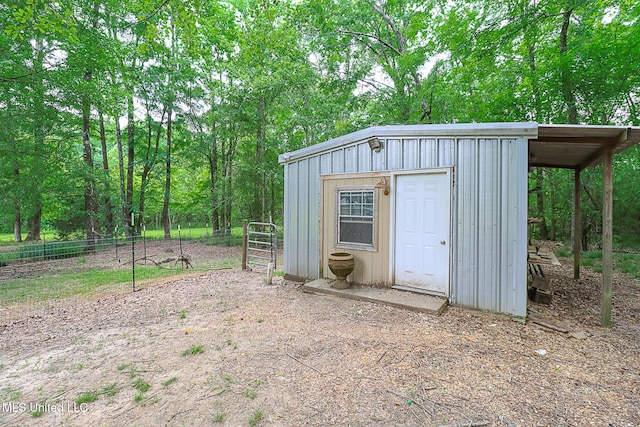 view of shed with fence