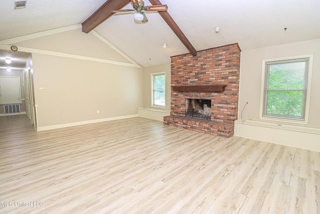 unfurnished living room featuring light wood-style floors, a ceiling fan, a brick fireplace, and baseboards