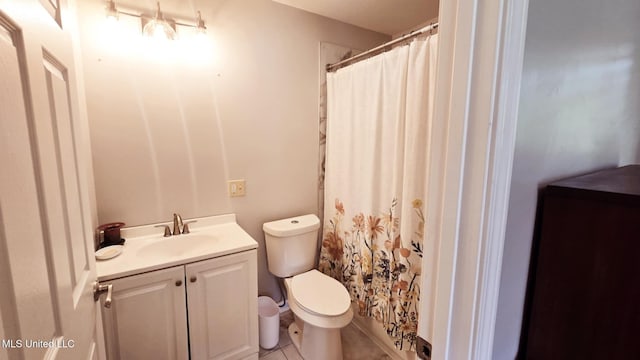 260 Roberts Ave, Holly Springs, MS 38635 - full bath featuring vanity, tile patterned floors, toilet, and a shower with curtain