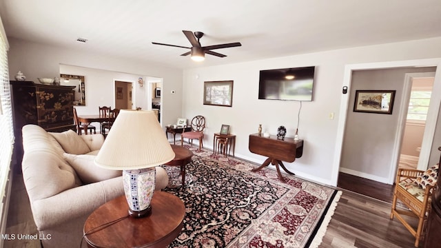 260 Roberts Ave, Holly Springs, MS 38635 - living area with baseboards, a ceiling fan, wood finished floors, and visible vents