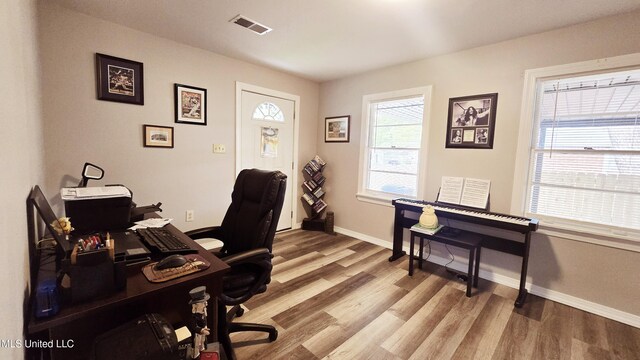 260 Roberts Ave, Holly Springs, MS 38635 - office space featuring baseboards, visible vents, and light wood-style floors