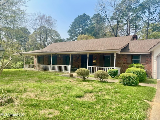 ranch-style home with a porch, a garage, and a front lawn