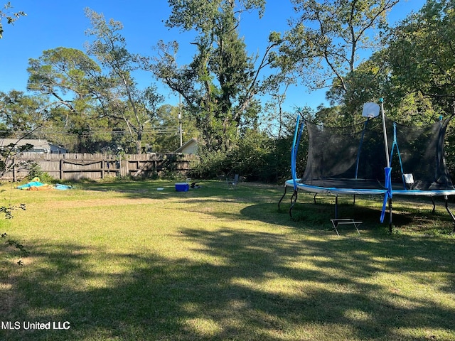 view of yard with a trampoline