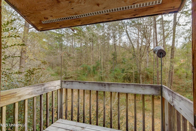 deck featuring a forest view