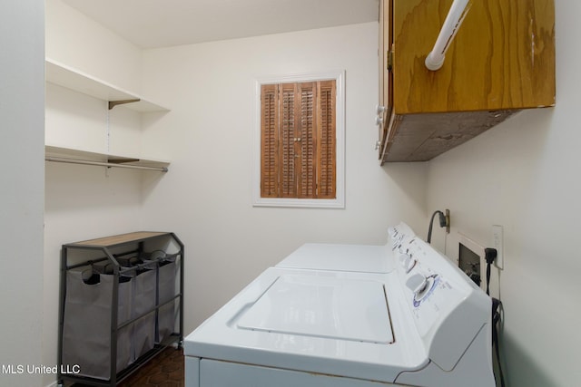 laundry area with washer and dryer and cabinet space