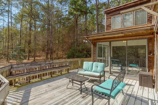 wooden terrace featuring an outdoor living space