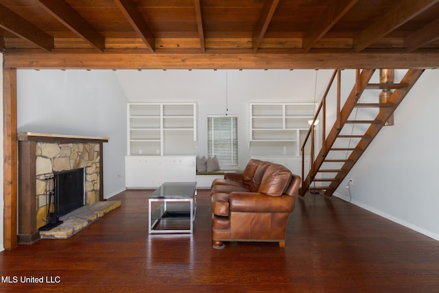 living area featuring a fireplace, wood finished floors, wood ceiling, stairway, and beamed ceiling