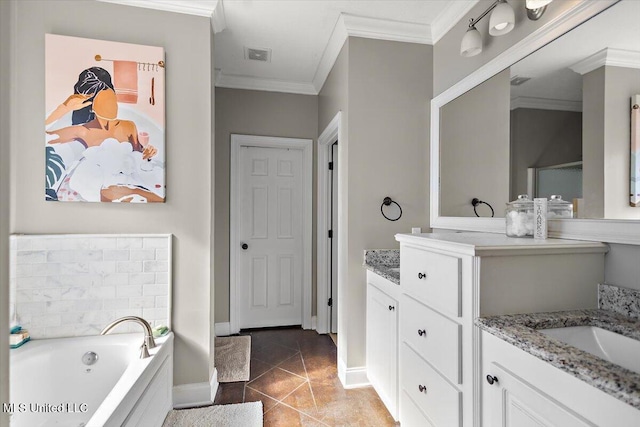 bathroom with tile patterned floors, ornamental molding, a tub to relax in, and vanity