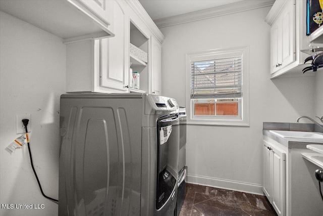 washroom with washer and dryer, cabinets, sink, and ornamental molding