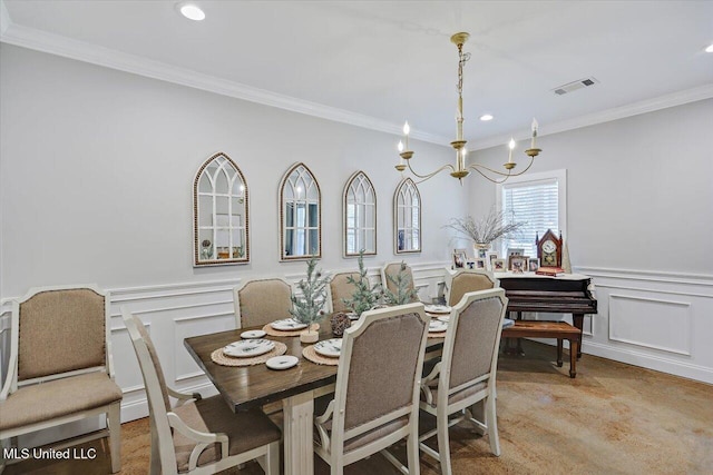 dining area with a decorative wall, a wainscoted wall, recessed lighting, visible vents, and ornamental molding