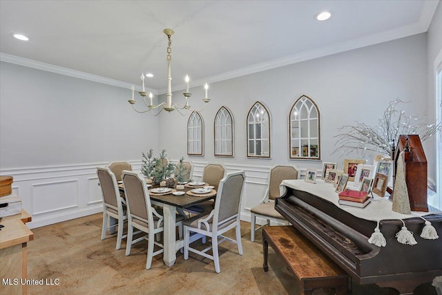 dining room with recessed lighting, a chandelier, crown molding, and wainscoting