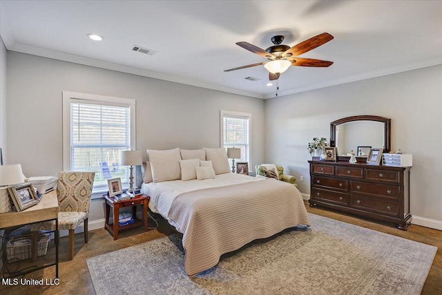 bedroom with crown molding, a ceiling fan, visible vents, and baseboards