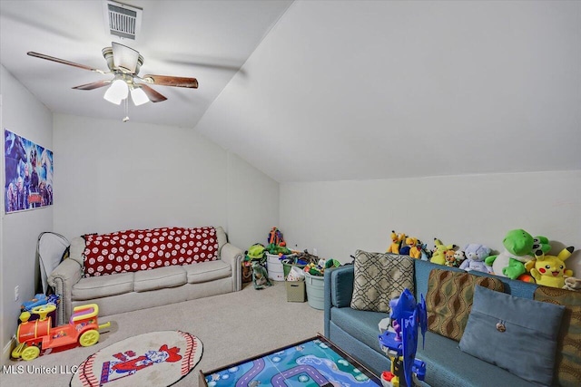 recreation room featuring vaulted ceiling, carpet floors, visible vents, and a ceiling fan