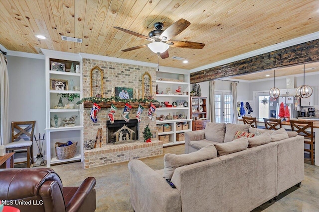 living area with built in shelves, wooden ceiling, visible vents, and a fireplace