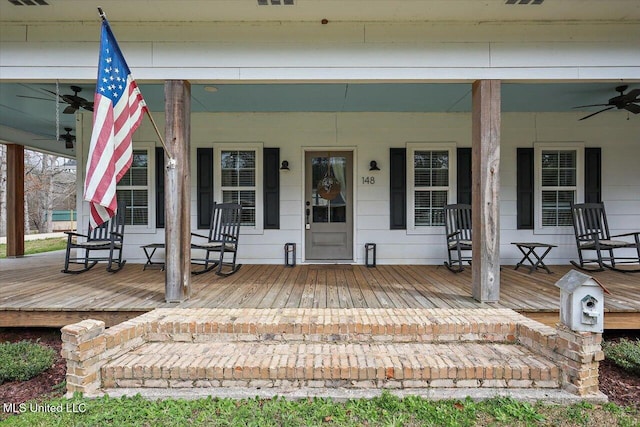 exterior space featuring covered porch, visible vents, and a ceiling fan