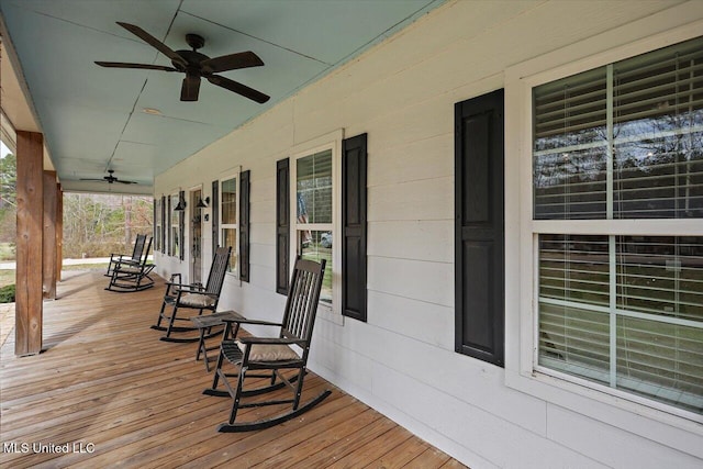 deck with a porch and a ceiling fan