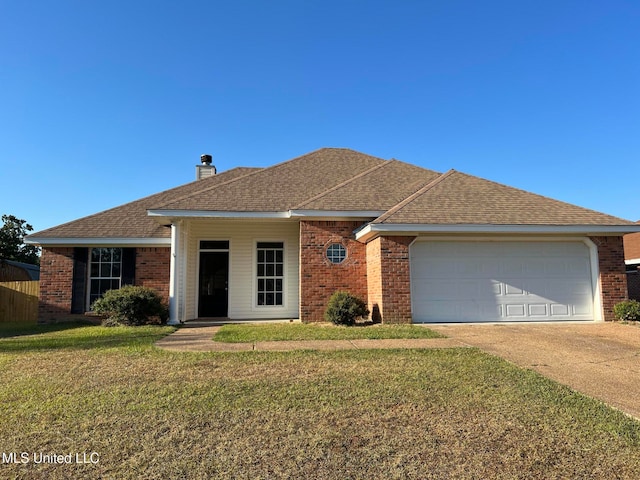 single story home featuring a garage and a front lawn