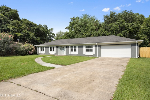 single story home with a front yard and a garage