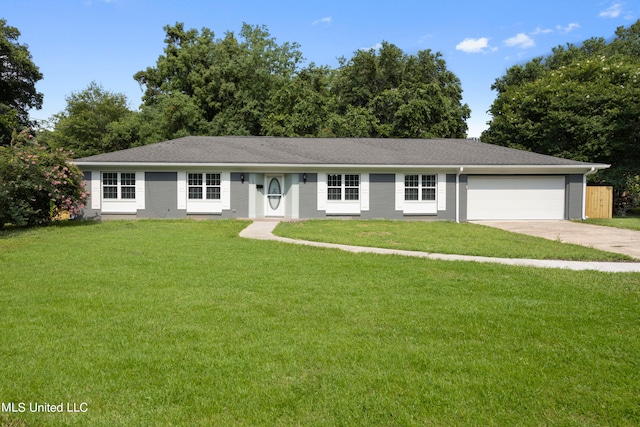 single story home featuring a front yard and a garage