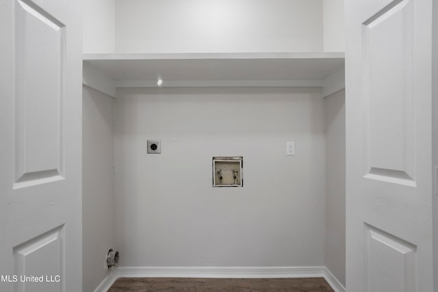 clothes washing area with hookup for a washing machine, electric dryer hookup, and dark hardwood / wood-style flooring