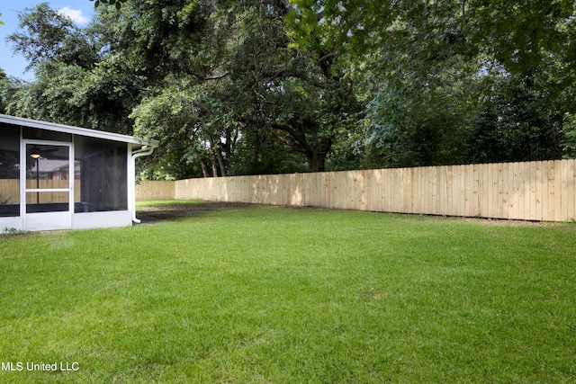 view of yard featuring a sunroom