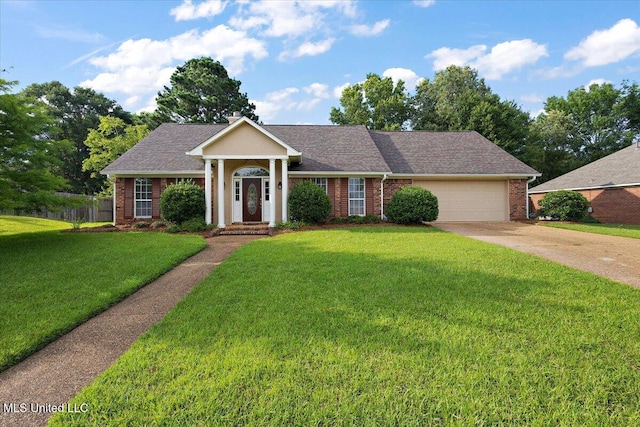 104 Willington Way, Madison, MS 39110 - greek revival inspired property featuring an attached garage, brick siding, a front lawn, concrete driveway, and roof with shingles