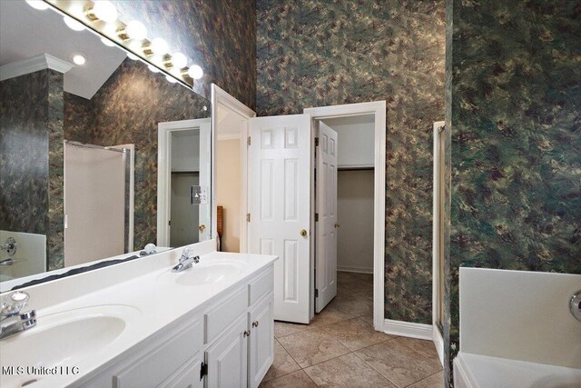 104 Willington Way, Madison, MS 39110 - full bathroom featuring wallpapered walls, a shower stall, tile patterned flooring, double vanity, and a bath