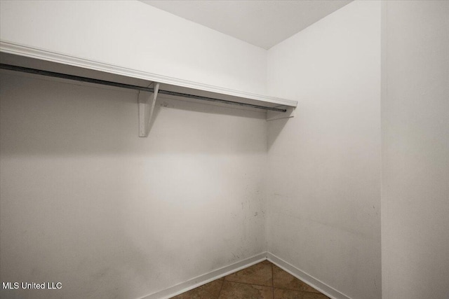 104 Willington Way, Madison, MS 39110 - spacious closet featuring dark tile patterned floors